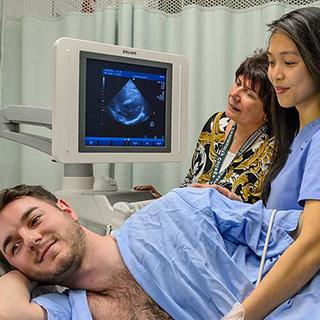 Ultrasound technician performing an cardiac ultrasound on a patient